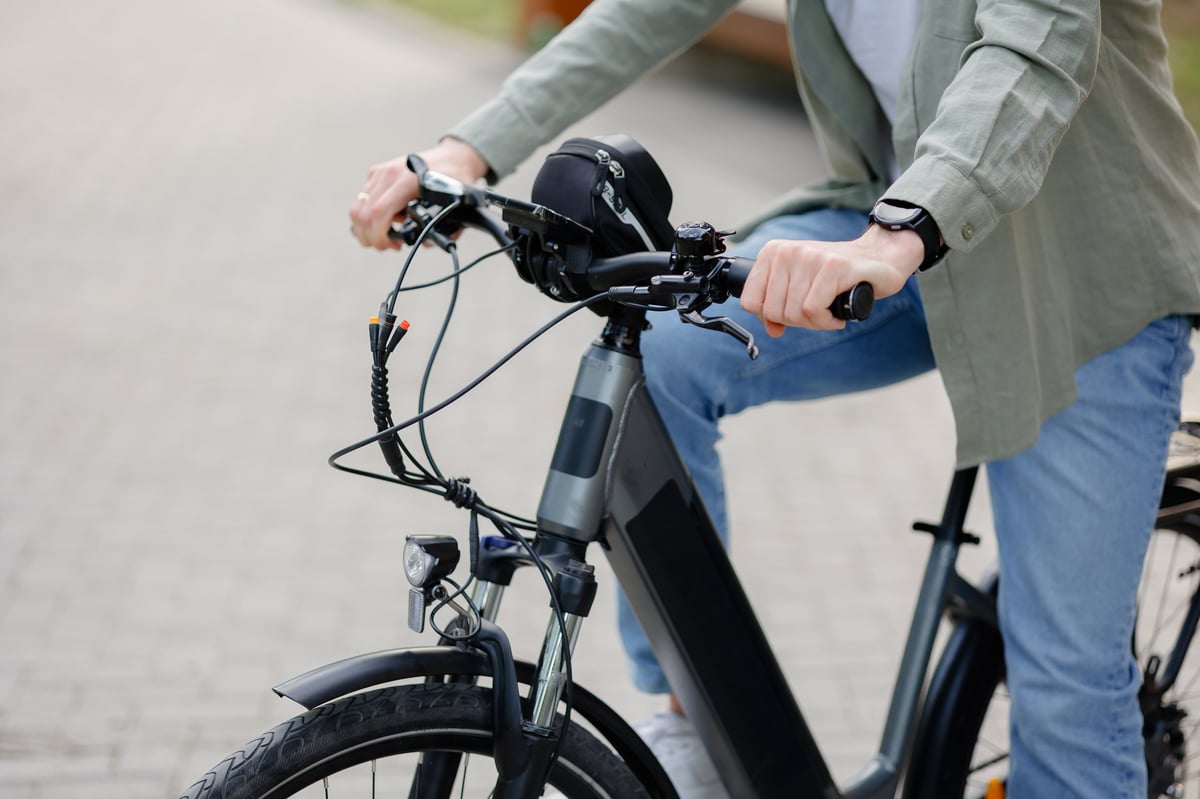 E-bike rider on a New Jersey pathway — safe, modern urban transportation